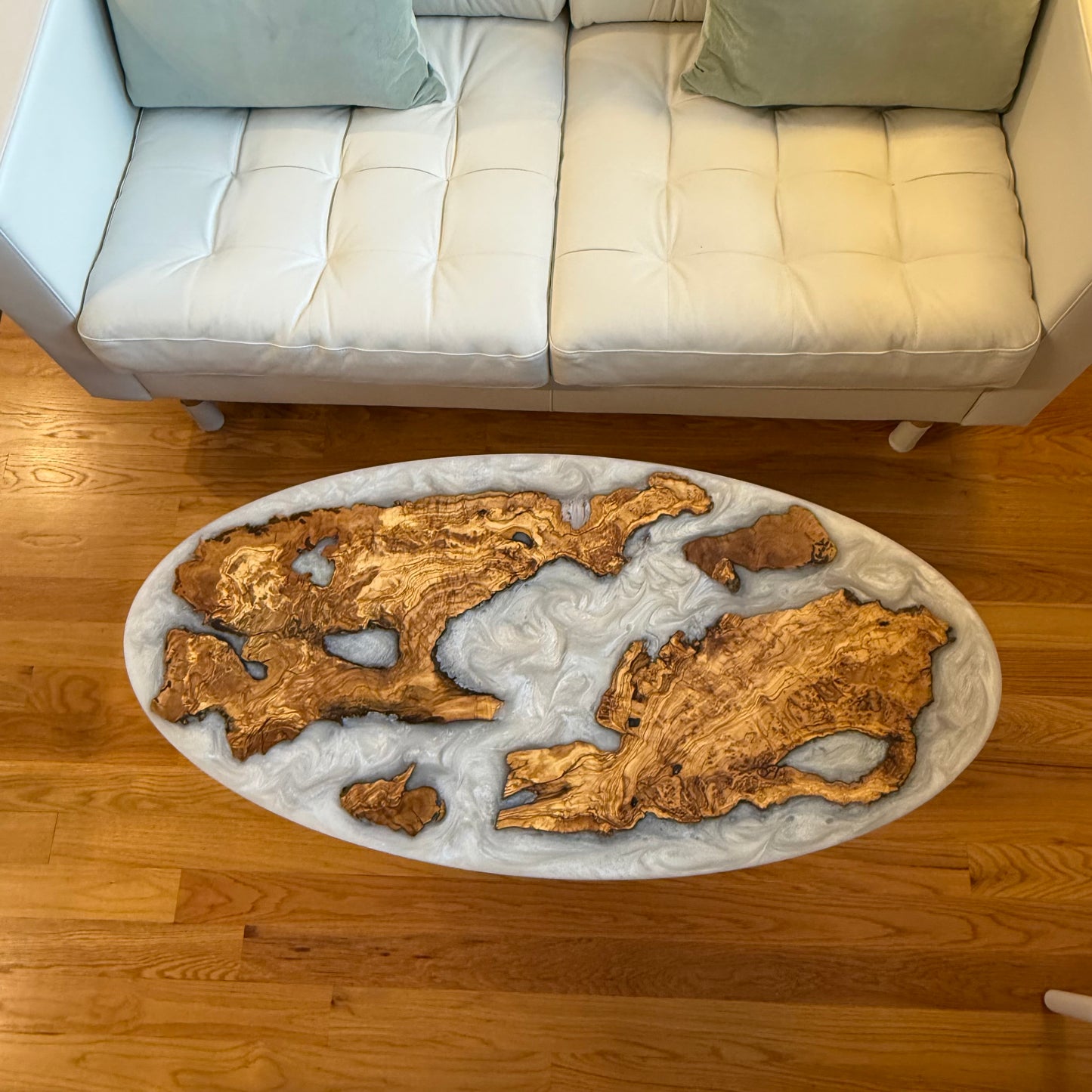 Handmade Olive Wood Live Edge Oval (Surfboard) Coffee Table w/ Pure White Pearl Swirls.